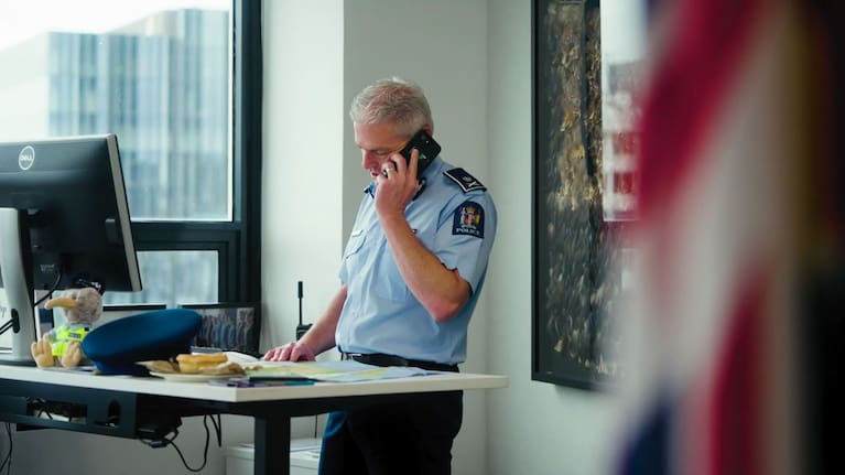 Police commissioner Richard Chambers in an ad aiming to bring NZ police recruits back from Australia.