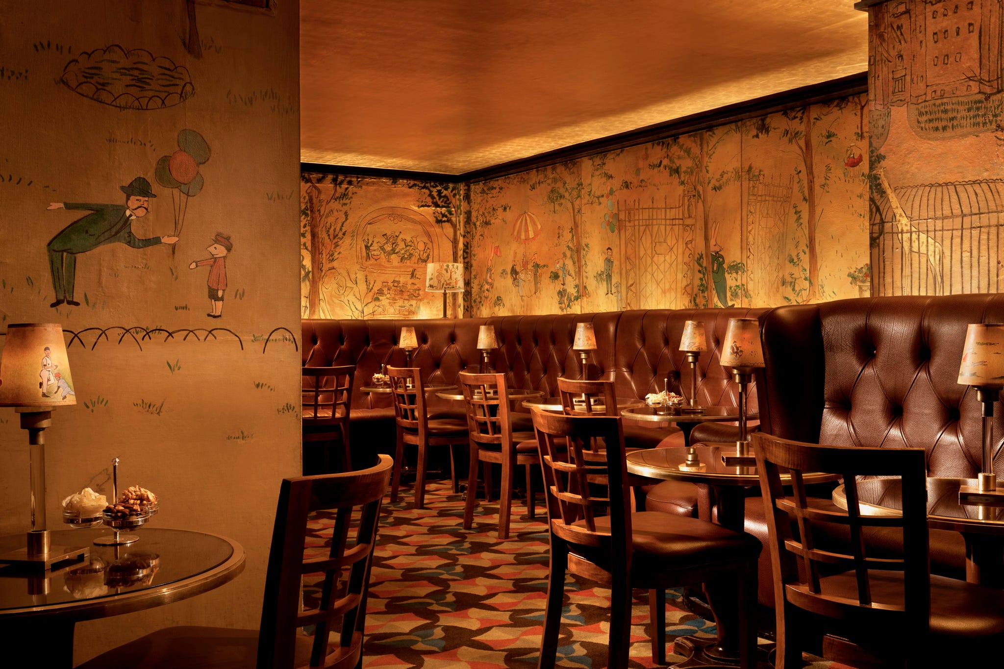 cozy cafe interior with patterned flooring and artistic wall designs