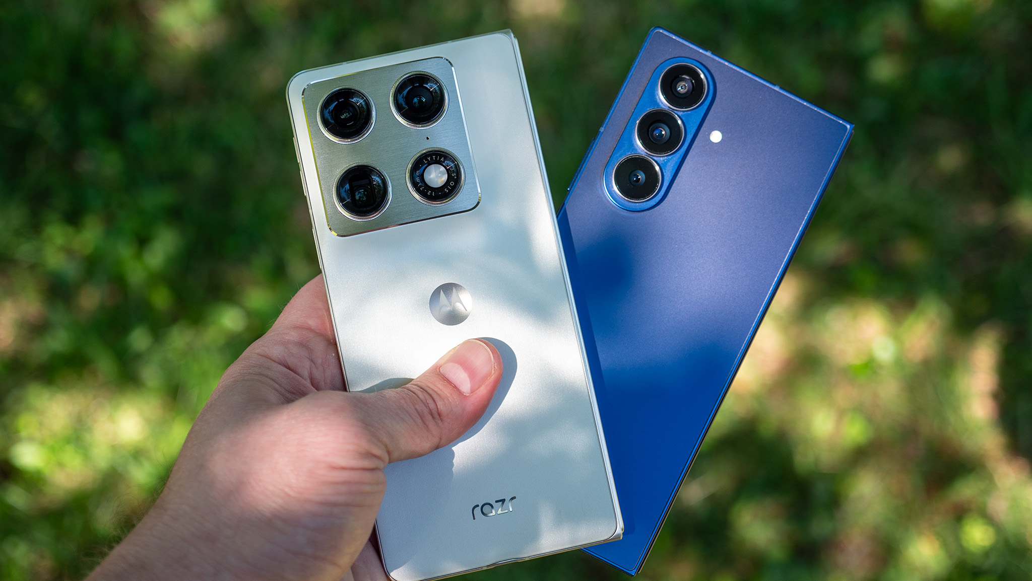 Comparing the blue Samsung Galaxy Z Fold 7 with the white Motorola Razr Fold 2026