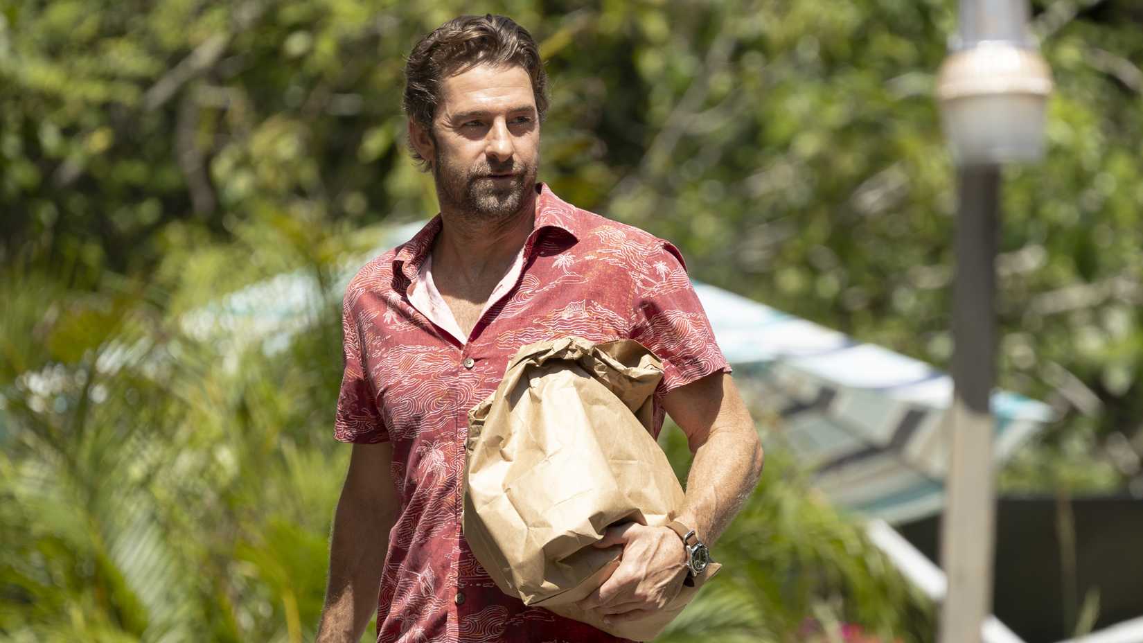 Scott Speedman as RJ Decker, looking at someone, in the debut episode