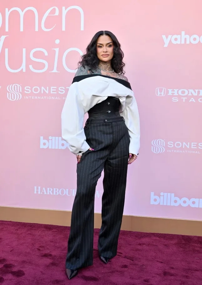 Kehlani stood out in a bold tailored look that mixed pinstripes, corsetry, and modern edge.