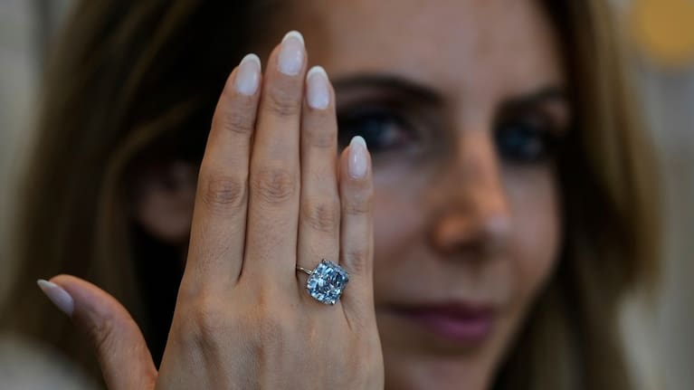 Sotheby's Deputy Chairman, Middle East & Head of Sotheby's UAE, Katia Noun Boueiz wears the Mediterranean Blue diamond during its worldwide debut in Abu Dhabi, United Arab Emirates.