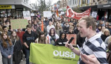 Students march to Octagon in protest of scrapping fees free