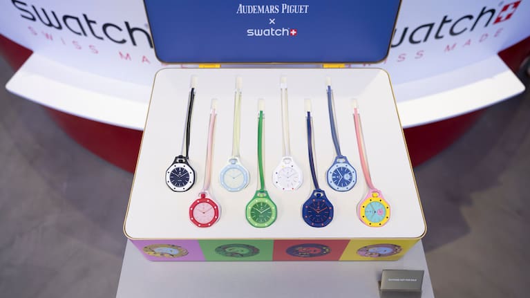 A saleswoman shows the new Royal Pop watches by Swatch and Audemars Piguet, in Geneva, Switzerland