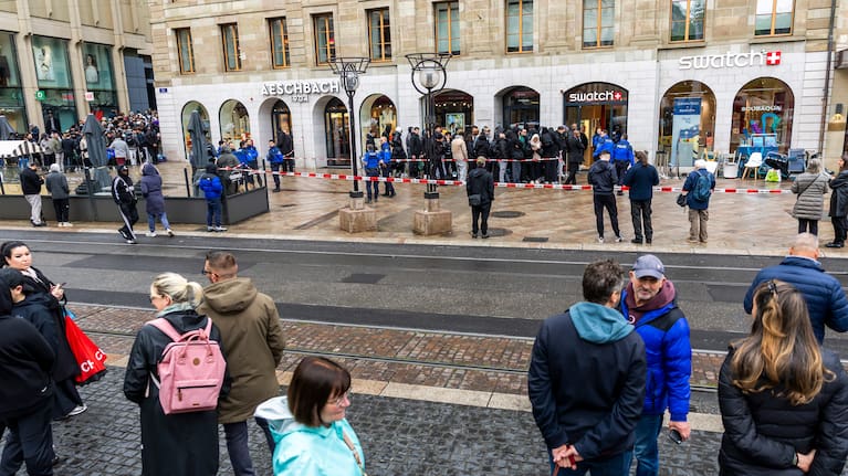 Swiss police officers secure the area where customers queue to buy the new Royal Pop watch by Swatch and Audemars Piguet