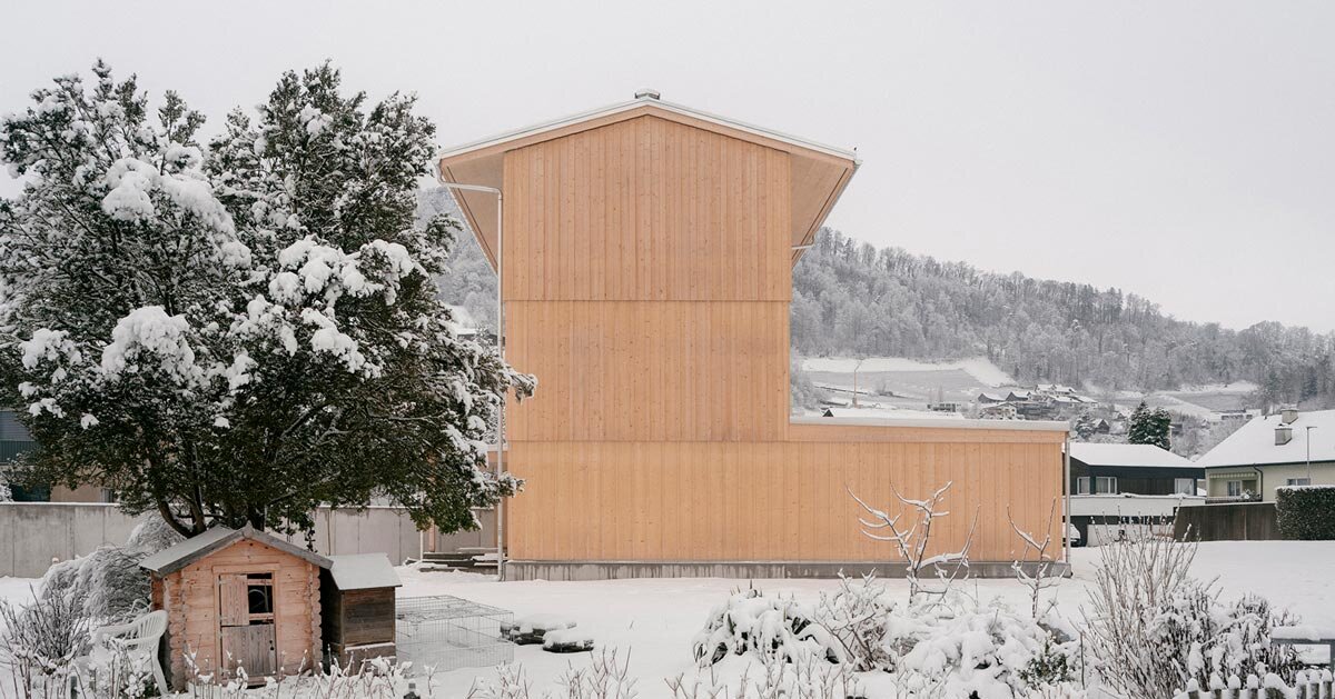 timber tower house rises from a triangular site in switzerland