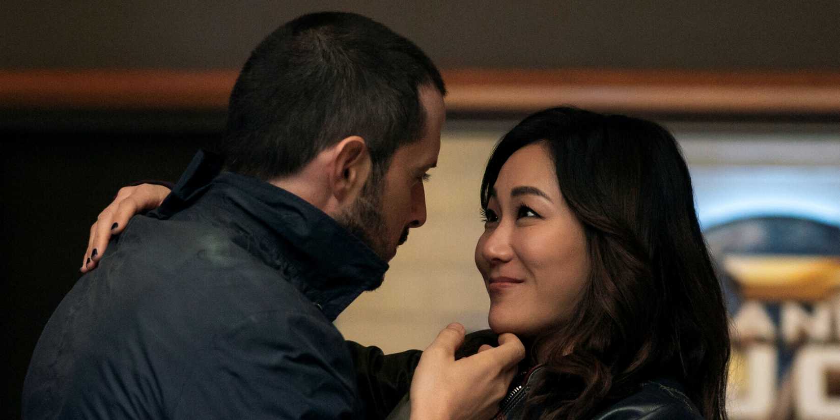 Tomer Capone as Frenchie with his hand under the chin of Karen Fukuhara as Kimiko in The Boys Season 5