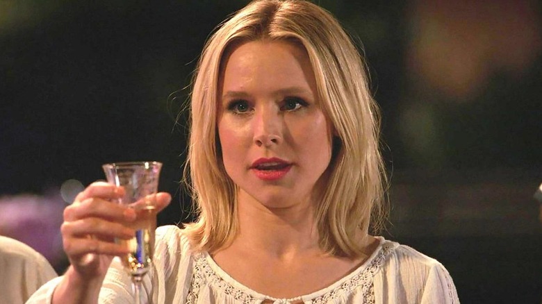 Kristen Bell as Eleanor raising a toast in The Good Place