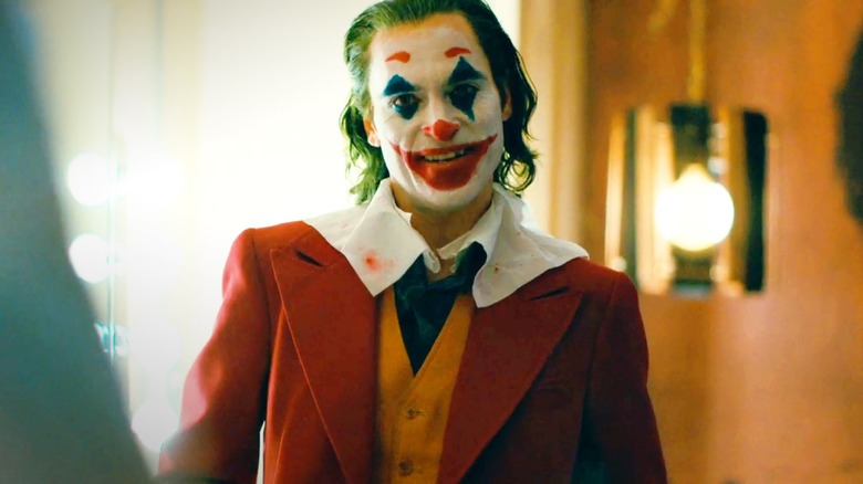 Joaquin Phoenix as Arthur Fleck in his full Joker makeup in Joker