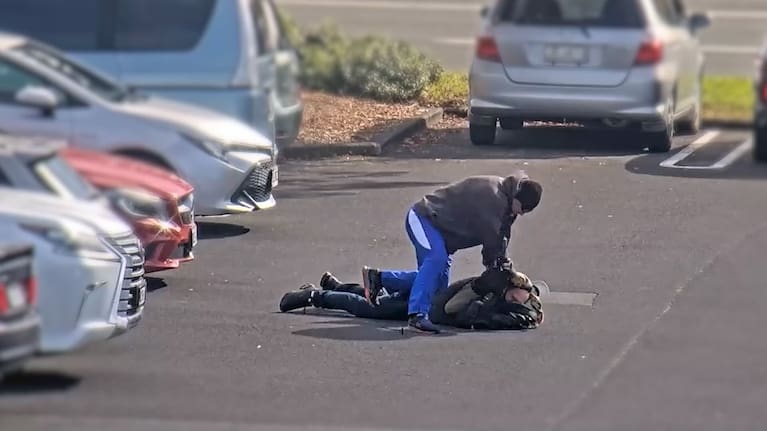 The man was pursued by a plainclothes police officer in the West Auckland car park. 