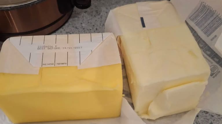 The sunny yellow block (left) is New Zealand made product, while the American butter from grain fed cows is a paler tone.