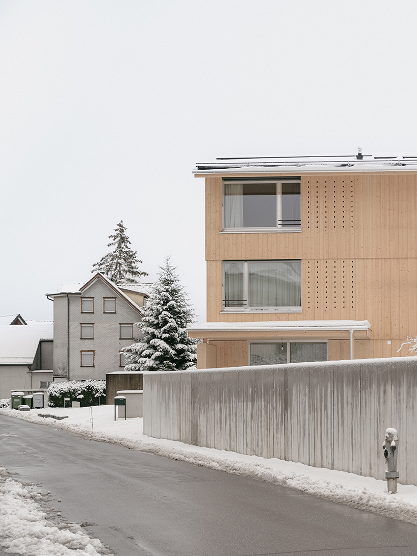 the tower house explores vertical living through prefabricated timber design 5