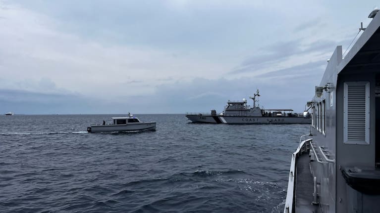 This image released by the Maldives President's Media Division, shows a coast guard boat and other vessels deployed to search for the four missing Italian divers near Alimathaa Island, Vaavu Atoll, Maldives, Saturday, May 15, 2026.