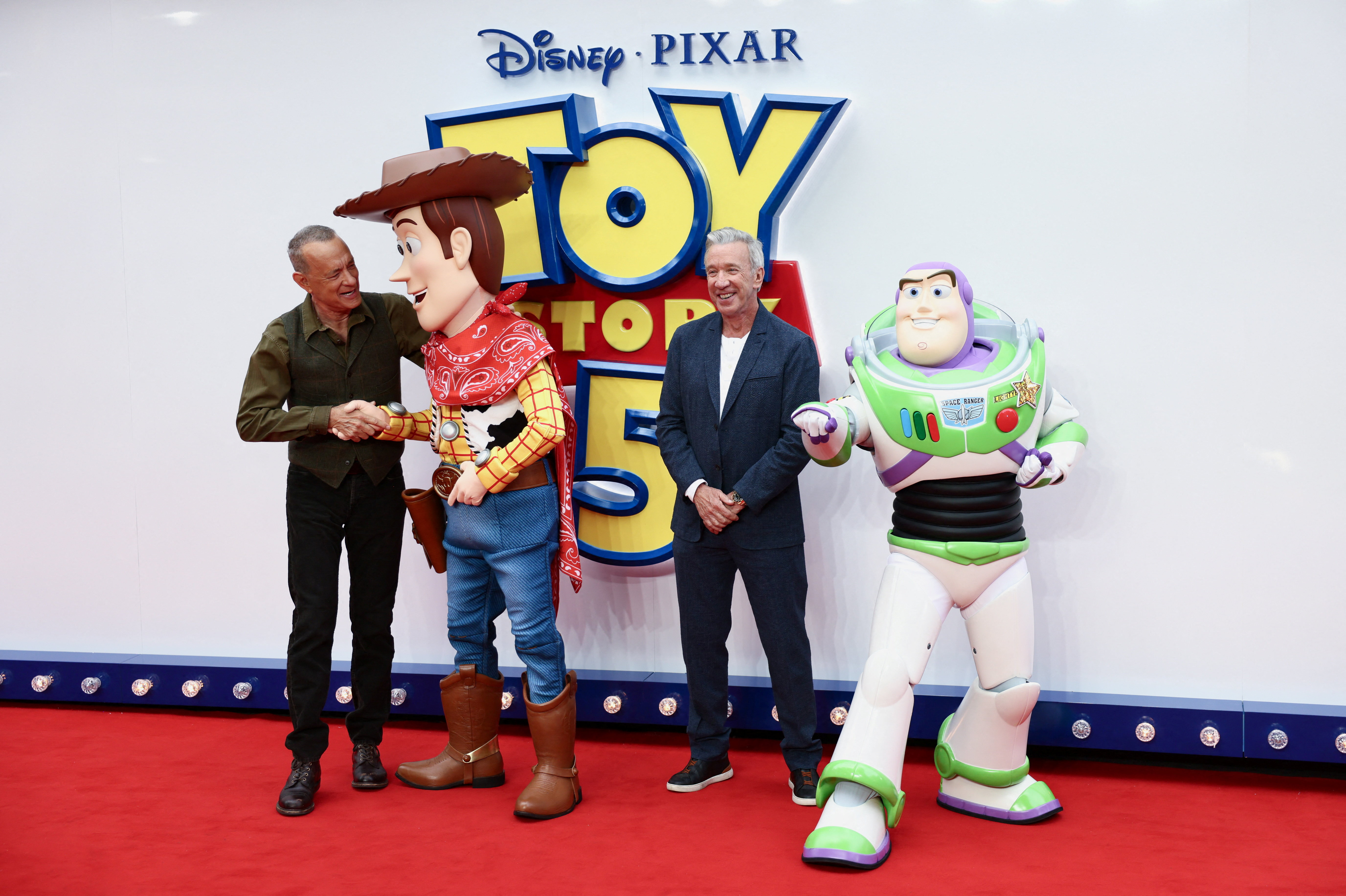 Tom Hanks, Woody, Tim Allen, and Buzz Lightyear attend the "Toy Story 5" UK launch premiere at Odeon Luxe Leicester Square on May 28, 2026 in London, England. 