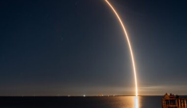 A rocket launch over the water.