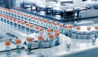 Vaccine vials on a conveyor belt.