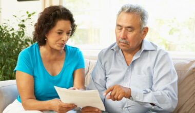 Couple discussing a document together.