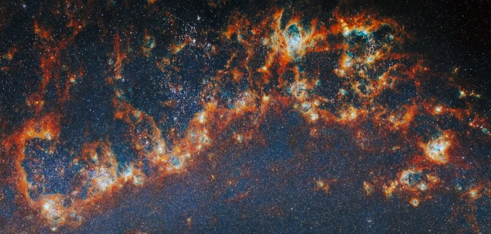 This is one of the arms in M51, a spiral galaxy also known by its popular name the Whirlpool galaxy. The JWST captured this image with its Near-Infrared Camera (NIRCam). The image is part of an effort to study star clusters, and how their stellar feedback shapess further star formation and galaxy evolution. Image Credit: ESA/Webb, NASA &amp; CSA, A. Pedrini, A. Adamo (Stockholm University) and the FEAST JWST team