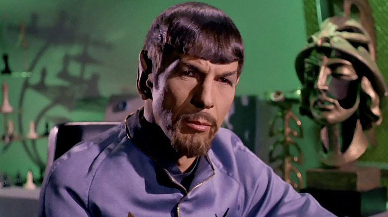 Closeup of Mr. Spock sitting and looking serious in 