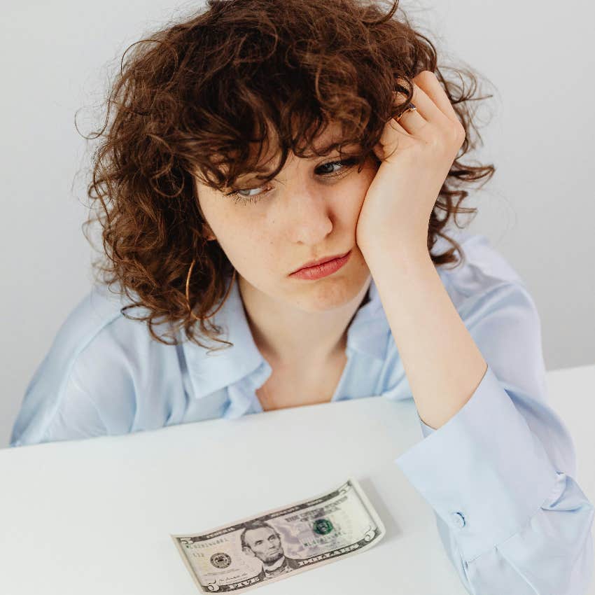 woman worried about being at the bottom of the k-shaped economy