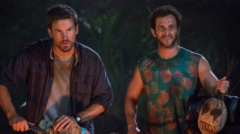 Zach Cregger as Owen next to Brian Greenberg and Todd by a campfire in Wrecked