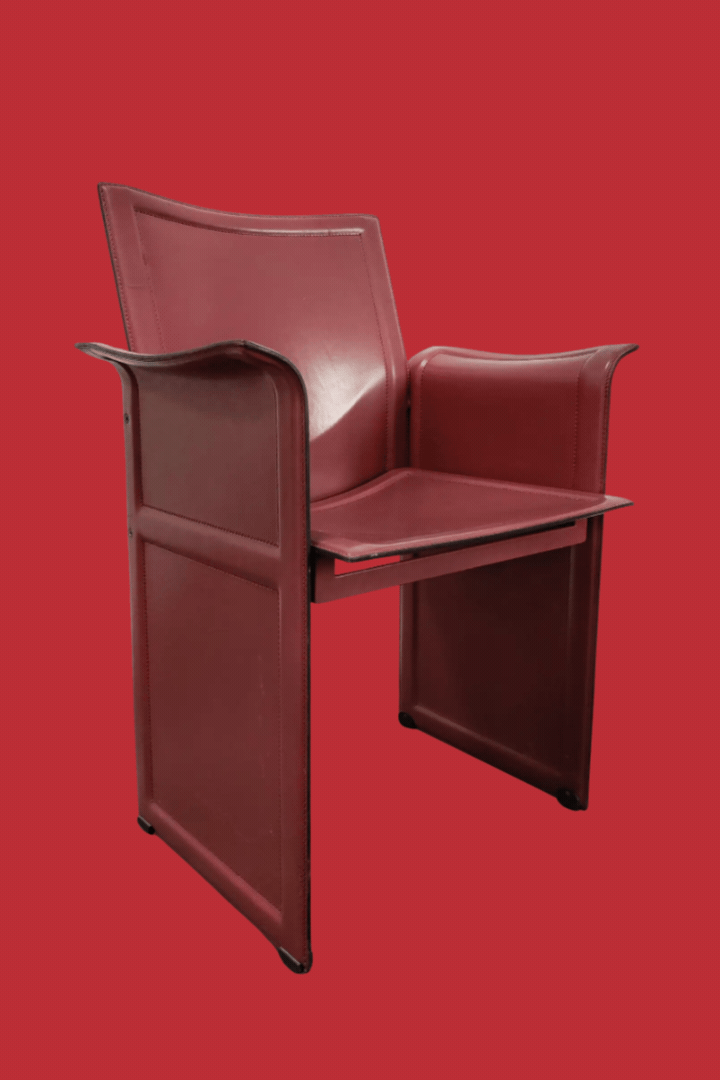 Leather Dining Chairs by Tito Agnoli for Matteo Grassi, Model Korium, Italy 1979 in a rotating gif against red background.