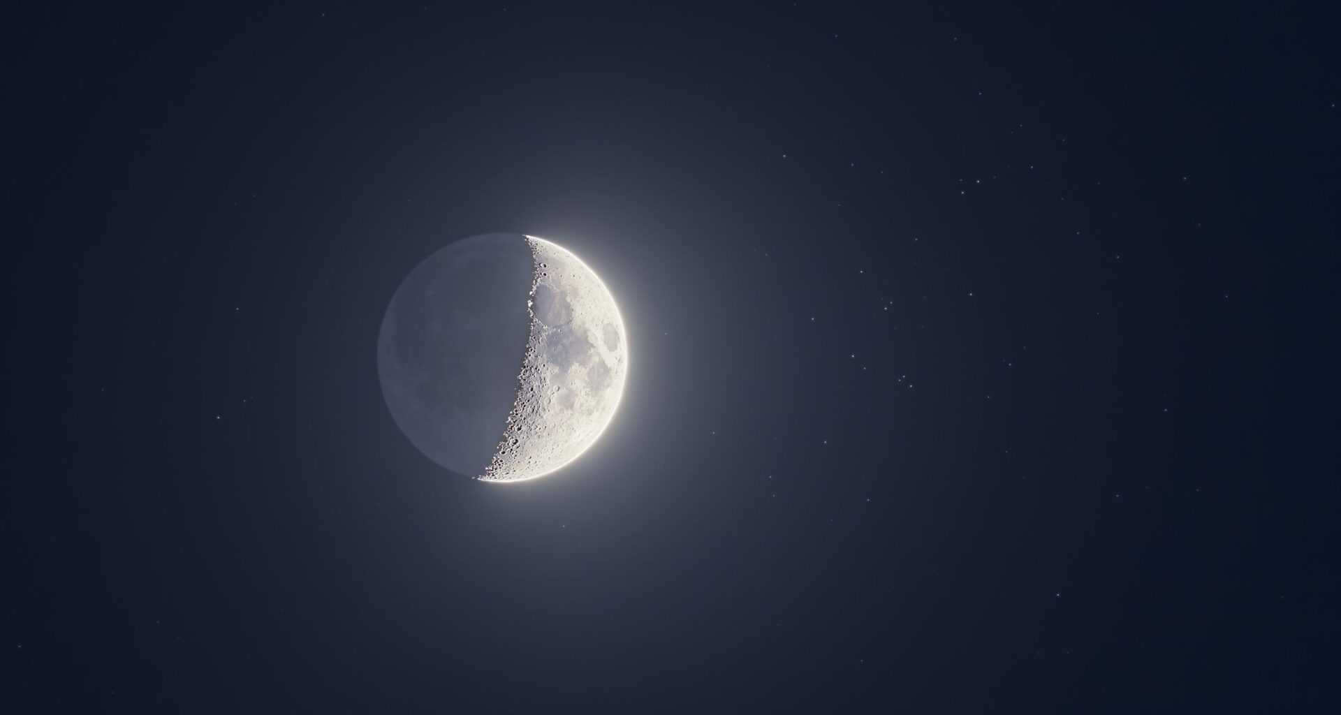 The moon shines with a swarm of stars on May 21 as Jupiter, Venus and Mercury line-up nearby