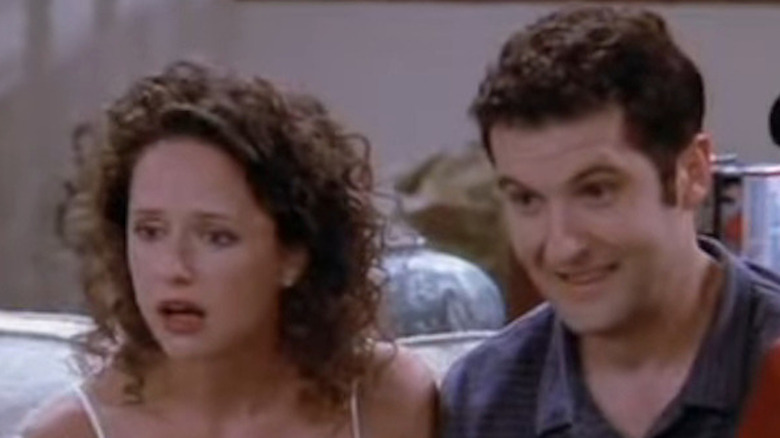 Jean Louisa Kelly as Kim looking dismayed and Anthony Clark as Greg looking excited in Yes, Dear