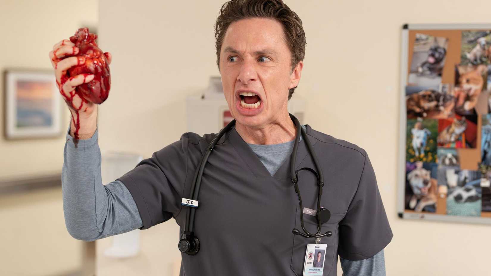 Zach Braff holding a heart in his hand as JD in Scrubs