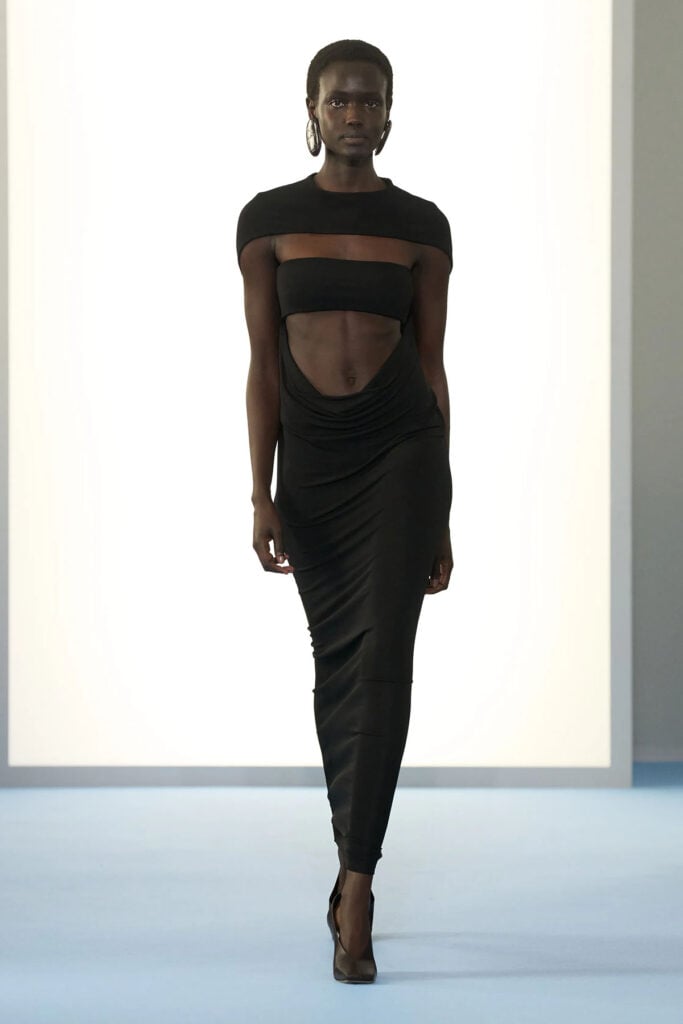 Sportmax Fall 2026 black cut-out scarf-detailed dress runway reference worn by Jodie Comer in London.