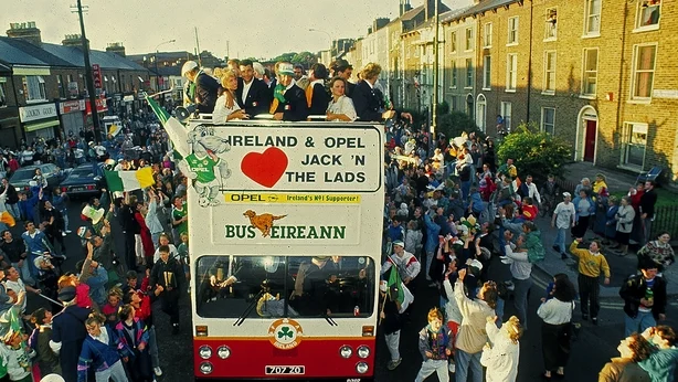 A bus brings the Irish soccer team through the streets of Dublin