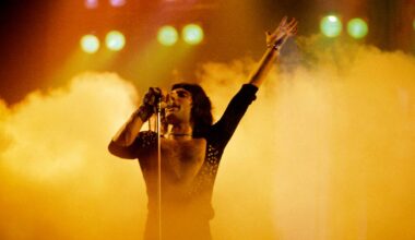 Freddie Mercury backstage at Live Aid followed by boyfriend Jim Hutton