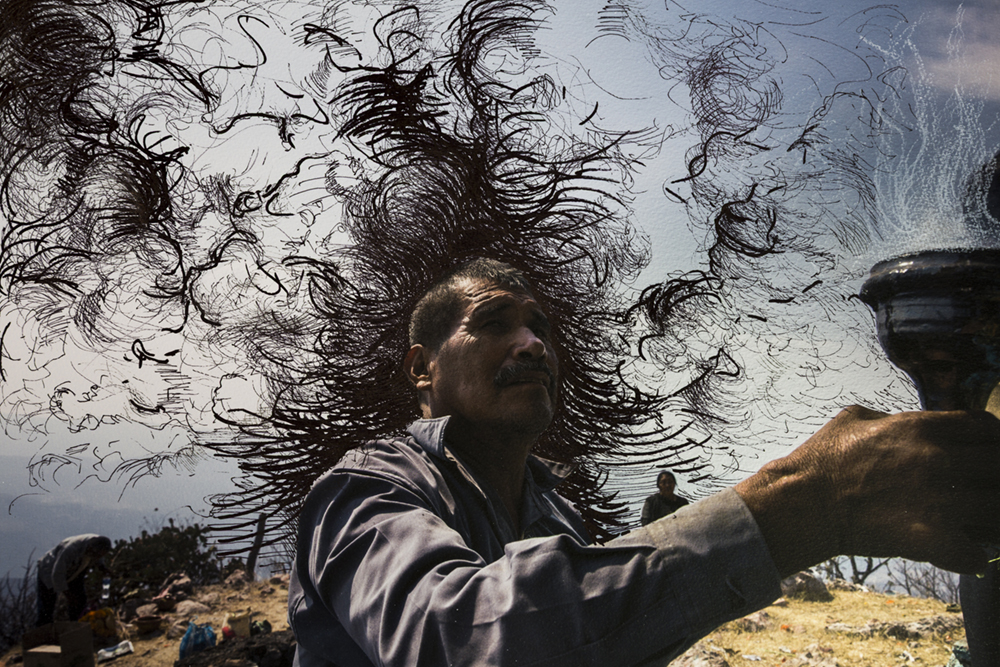 Mexico.Guerrero.Zitlala..A member of the Nahua community is making an offering to the cross at the Cruzco Hill in the community of Zitlala Guerrero. Intervened photography