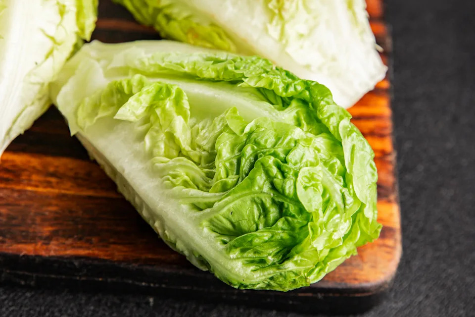 Romaine lettuce salad salad vegetables romano lunch or dinner tasty snack organic fresh and delicious gourmet food background on the table rustic food top view copy space keto and paleo diet vegetarian and vegan food