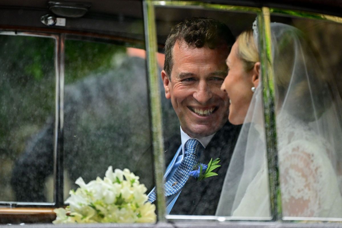 The married couple in a car after the ceremony
