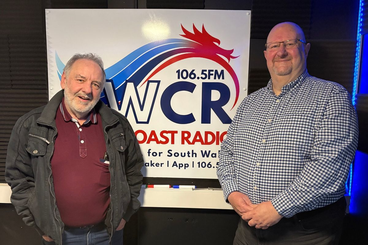 Two men pictured inside a radio station