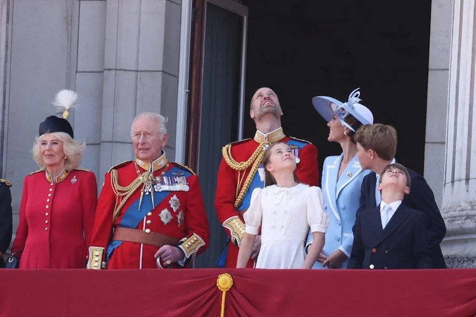 The Princess of Wales looking at Prince William as he gazes to the sky