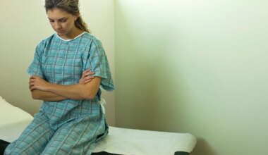 A photo of a woman sitting on an examination table.