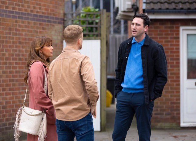 Kit talking to Maria and Gary outside the salon on Coronation Street