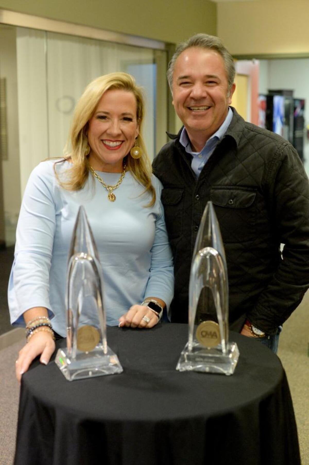 DeAnn Stephens and Don Evans with their CMA Awards for small-market personalities of the year.