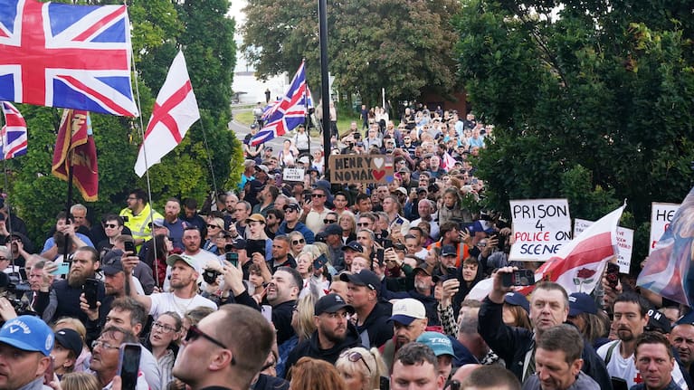 People gather to protest outside Southampton police station, Southampton, England, Tuesday June 2, 2026, after the fatal stabbing of Henry Nowak, a British teenager who was handcuffed despite claiming he was the crime victim