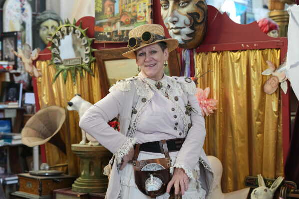 Steampunk NZ Festival chair Lea Campbell, dressed as her steampunk persona Dusty Traveller, poses for a portrait during the annual event in Ōamaru, New Zealand, Friday, May 29, 2026. (AP Photo/Charlotte Graham-McLay)