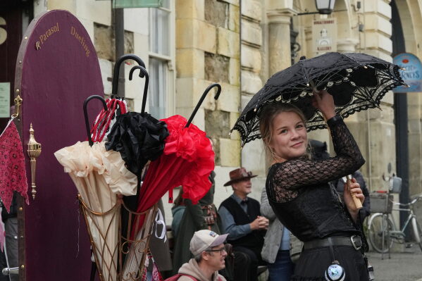 Ryleigh Shepherd competes in a parasol duelling contest at the Steampunk NZ Festival in Ōamaru, New Zealand, May 31, 2026. (AP Photo/Charlotte Graham-McLay)