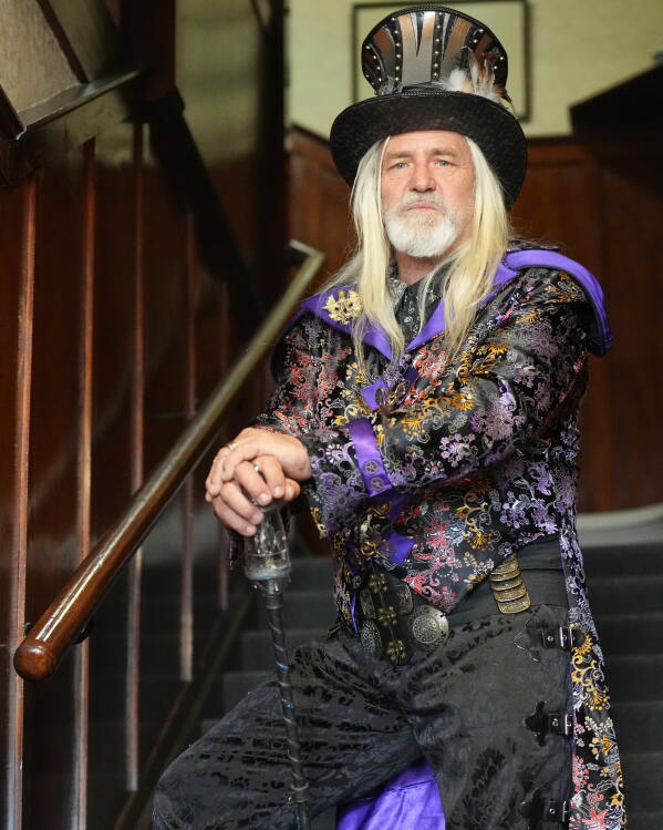 Steampunk NZ Festival attendee Carl Yates, dressed as his steampunk persona Sir Gideon Steamcrank, poses for a portrait during the annual event in Ōamaru, New Zealand, Friday, May 29, 2026. (AP Photo/Charlotte Graham-McLay)