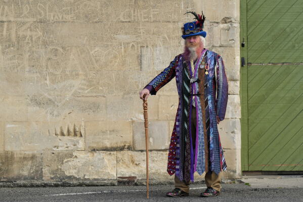Steampunk NZ Festival attendee Alan Bryan, wearing a coat he made from old ties, poses for a portrait during the annual event in Ōamaru, New Zealand, Saturday, May 30, 2026. (AP Photo/Charlotte Graham-McLay)