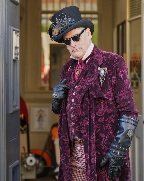 Steampunk NZ Festival attendee Ross McKay, dressed as his steampunk persona, Captain Roscoe Dangerfield, Inspector of Nuisances to Her Majesty Queen Victoria III, poses during the annual event in Ōamaru, New Zealand, Friday, May 29, 2026. (AP Photo/Charlotte Graham-McLay)