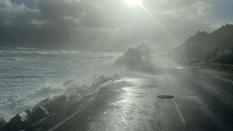 Waves break onto Cape Palliser Rd.