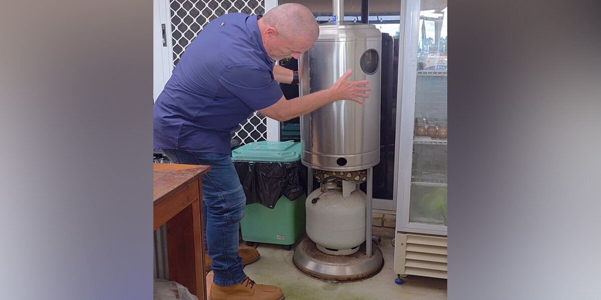 Man Lifts Propane Tank Cover — And Reveals A 6-Foot Scaly Surprise