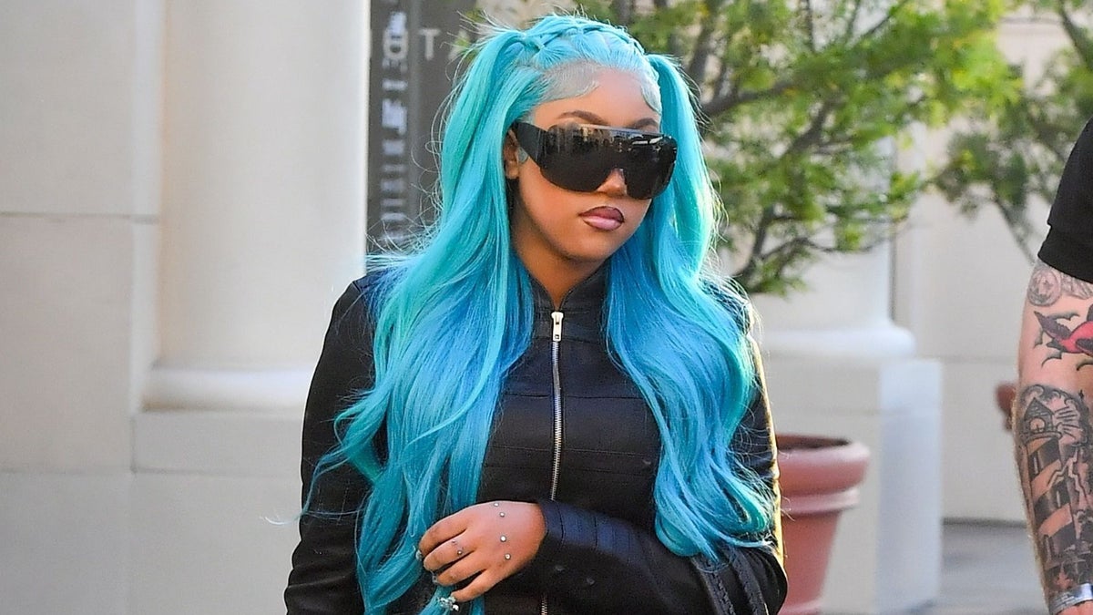 North West rocks an all-leather look, hand piercings and signature blue hair in Los Angeles