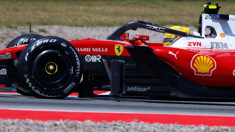 Ferrari driver Lewis Hamilton of Britain celebrates after wining the Spain F1 Grand Prix race at the Barcelona Catalunya racetrack in Montmelo, near Barcelona, Spain.